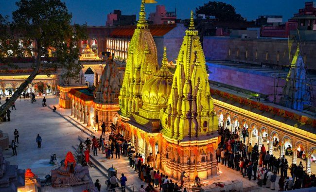 see the kashi vishwanath temple glowing at night, with its sacred jyotirlinga. a must see among varanasi tourist places