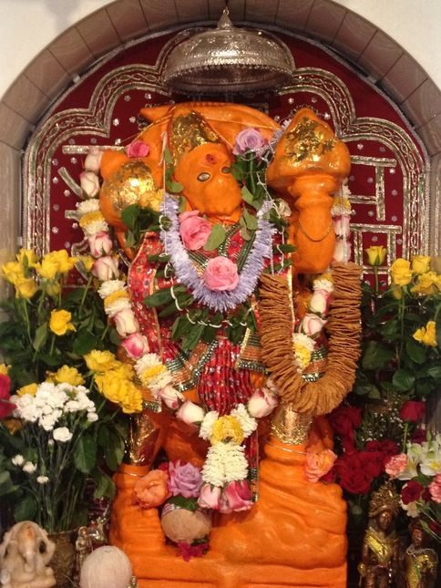 capture the divine essence of lord hanuman's idol at sankat mochan mandir in varanasi. accessible via taxi service in varanasi, it's a must visit attraction among varanasi tourist places.