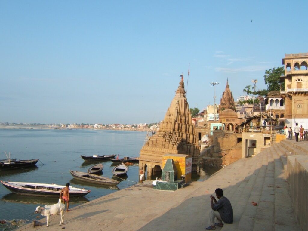 scindia ghat in varanasi, where the river ganges offers a serene and spiritual experience. easily accessible by cab from delhi to varanasi, it's a top attraction for tourists.